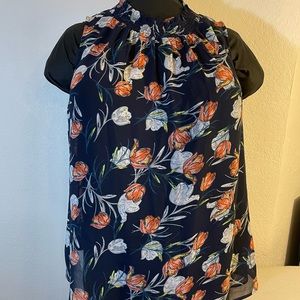 Smocked floral sleeveless blouse